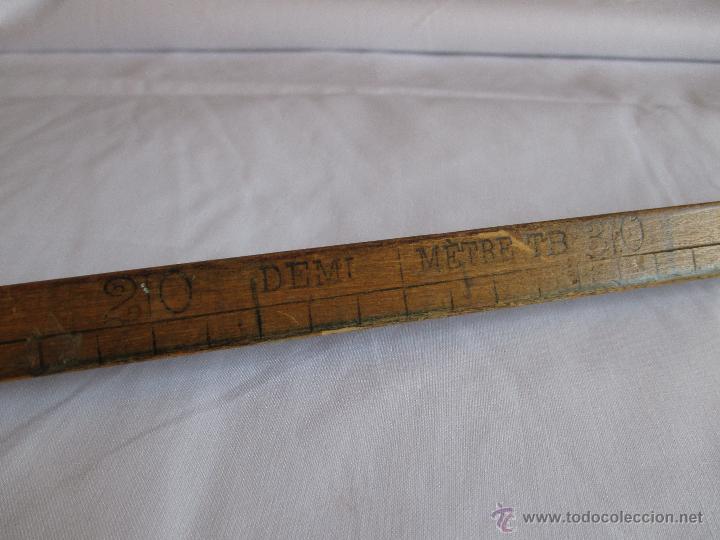 Antig&uuml;edades: medio metro de madera marca T B - Foto 5