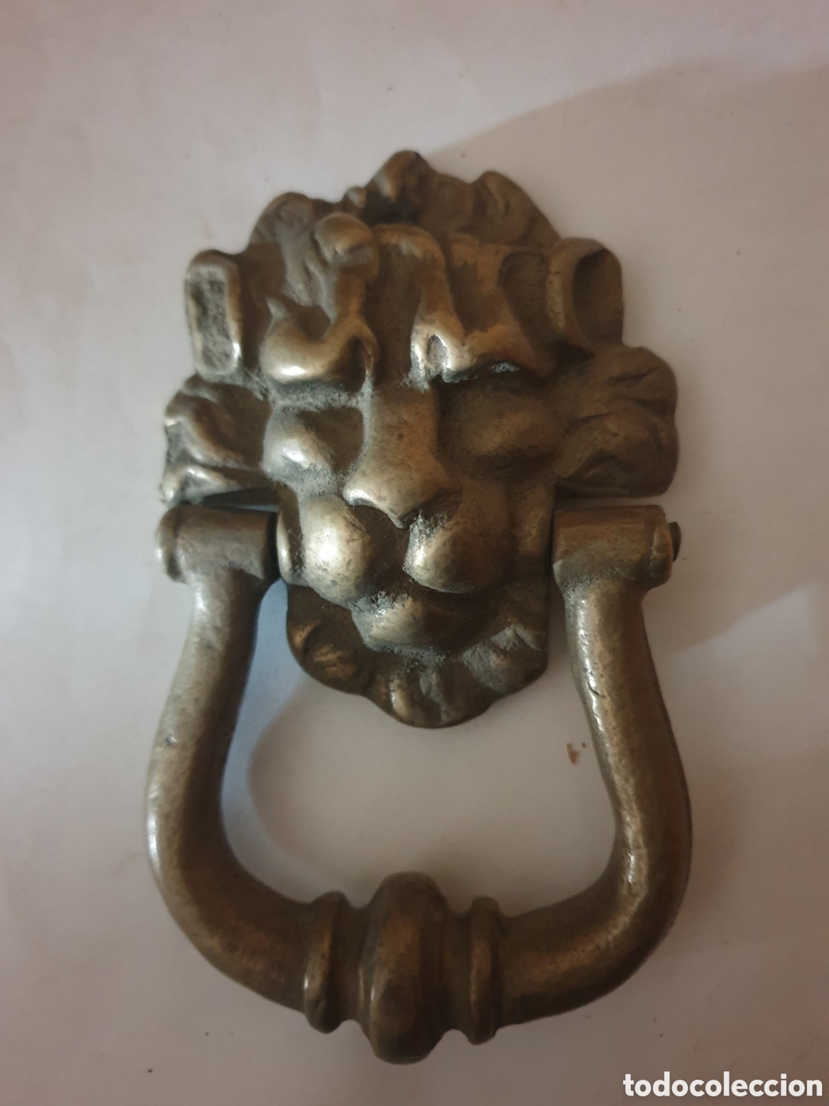 Antig&uuml;edades: ALDABA S. XX BRONCE CABEZA DE LEON - Foto 1