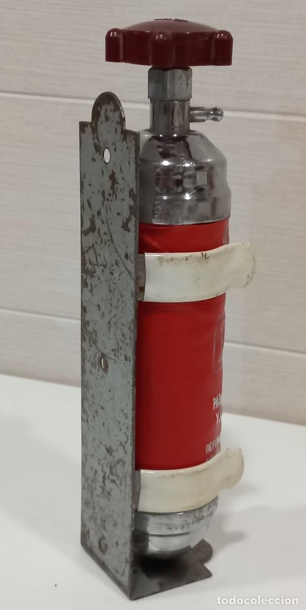 Antig&uuml;edades: MINI EXTINTOR CON SOPORTE Y RUEDA DE BAQUELITA - SOPIO - Foto 7