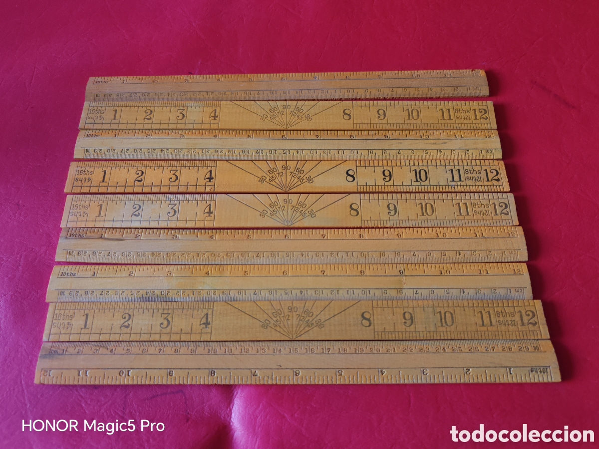 Antig&uuml;edades: Lote de 10 reglas escal&iacute;metro, hechas en madera