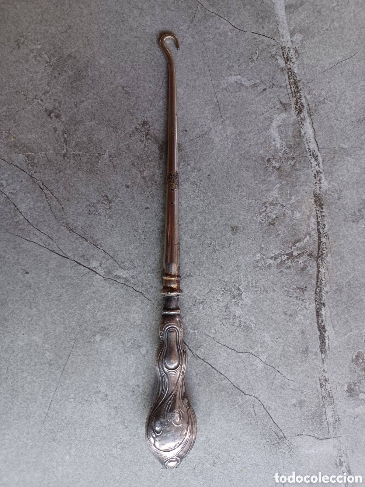 Antig&uuml;edades: Antiguo gancho para botines, mango de plata esterlina.