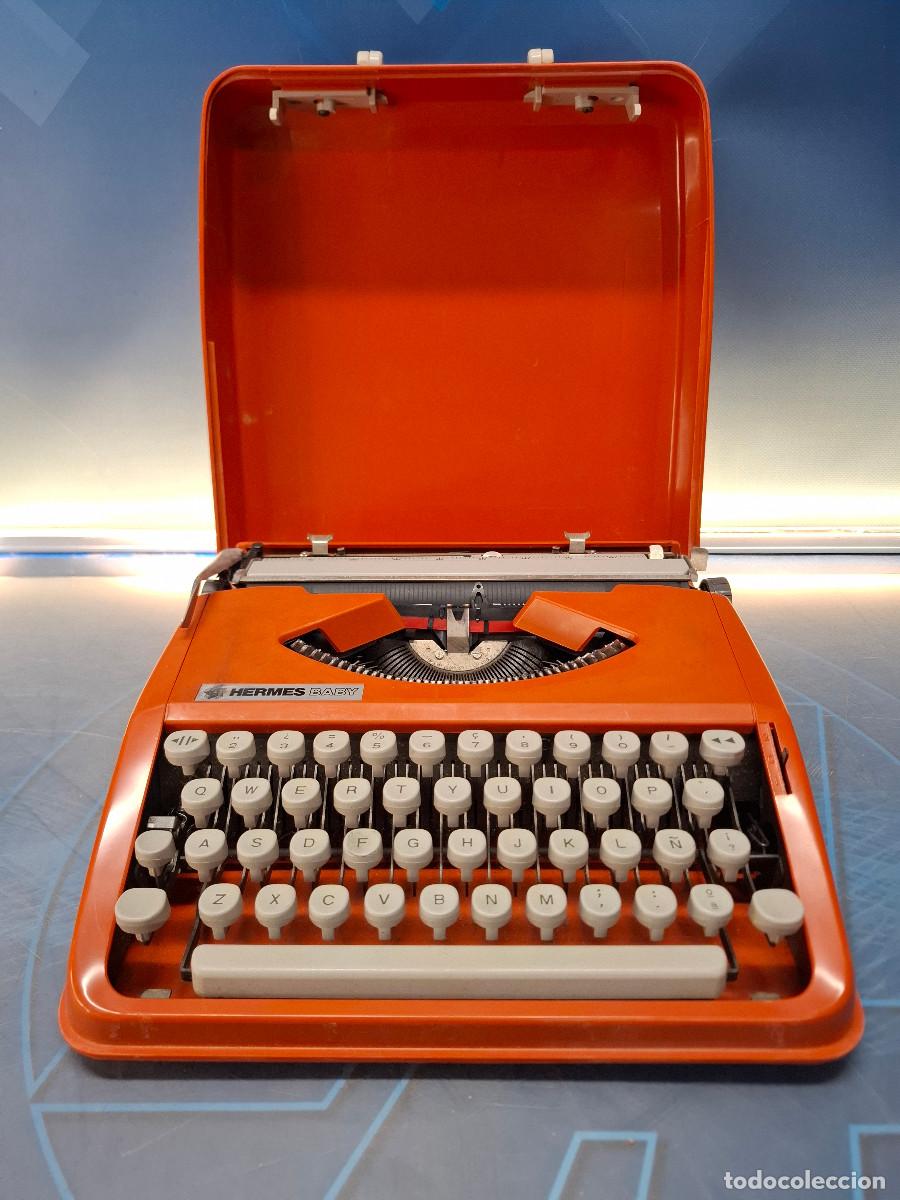 Antig&uuml;edades: Maquina de escribir, Hermes Baby naranja
