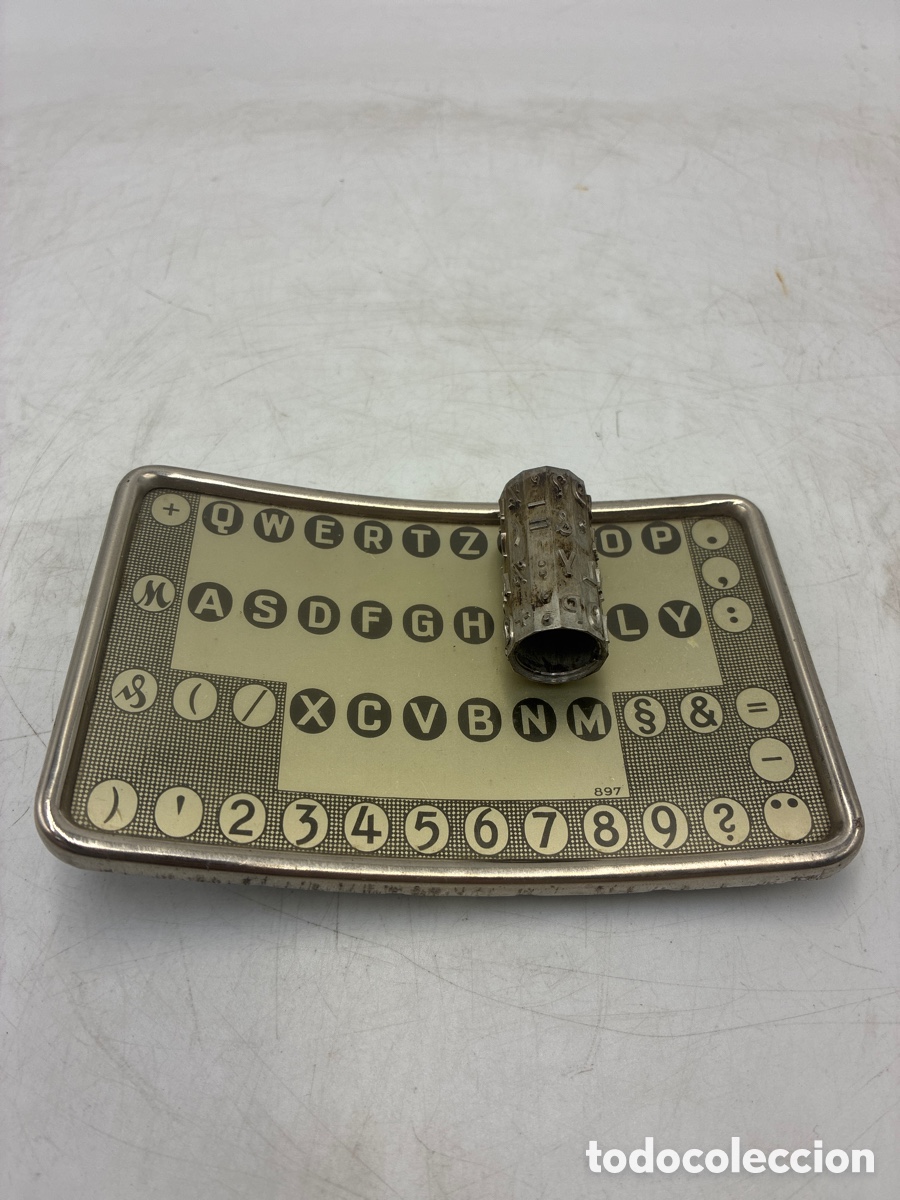 Antig&uuml;edades: Teclado y Cilindro de Mignon letra grande.