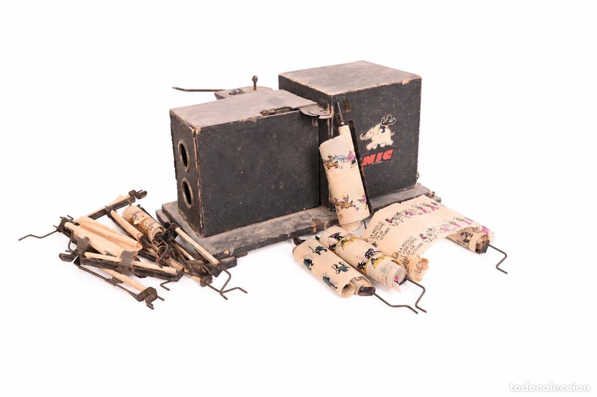 Antig&uuml;edades: Proyector Cine NIC antiguo con pel&iacute;culas y ejes originales &ndash; Para restaurar