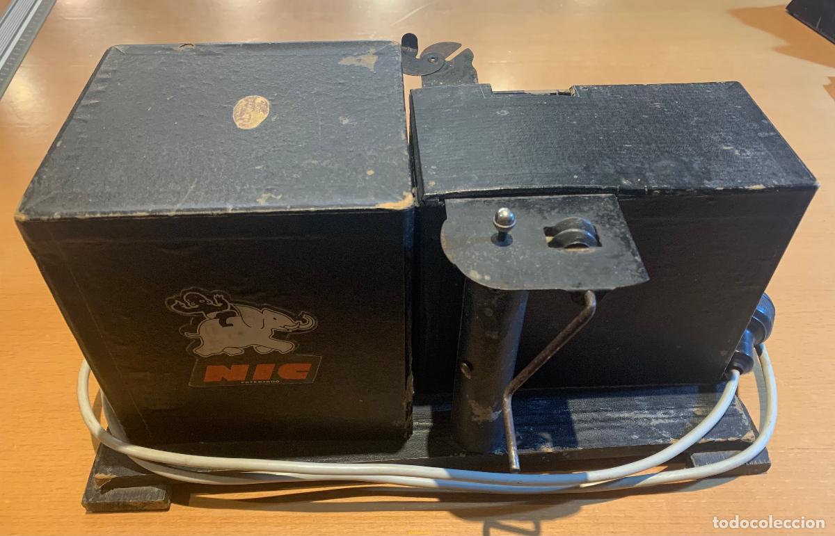 Antig&uuml;edades: PROYECTOR CINE NIC + 14 PELICULAS - Foto 3