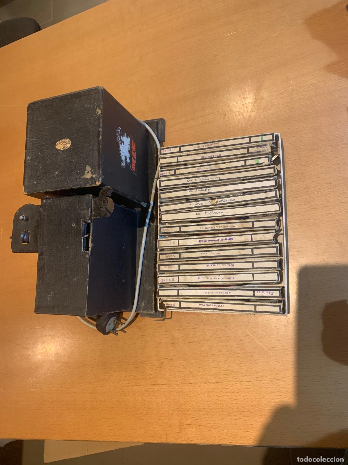 Antig&uuml;edades: PROYECTOR CINE NIC + 14 PELICULAS - Foto 8