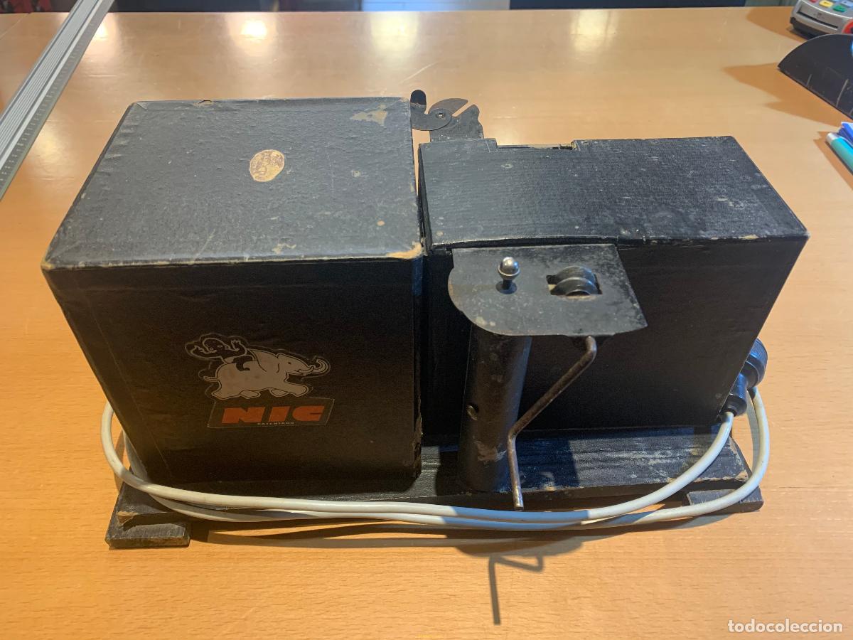 Antig&uuml;edades: PROYECTOR CINE NIC + 14 PELICULAS - Foto 9