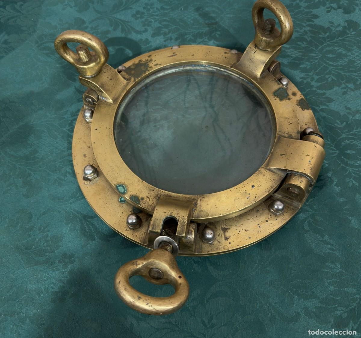 Antig&uuml;edades: Antigua ventana de ojo de buey de bronce para barco