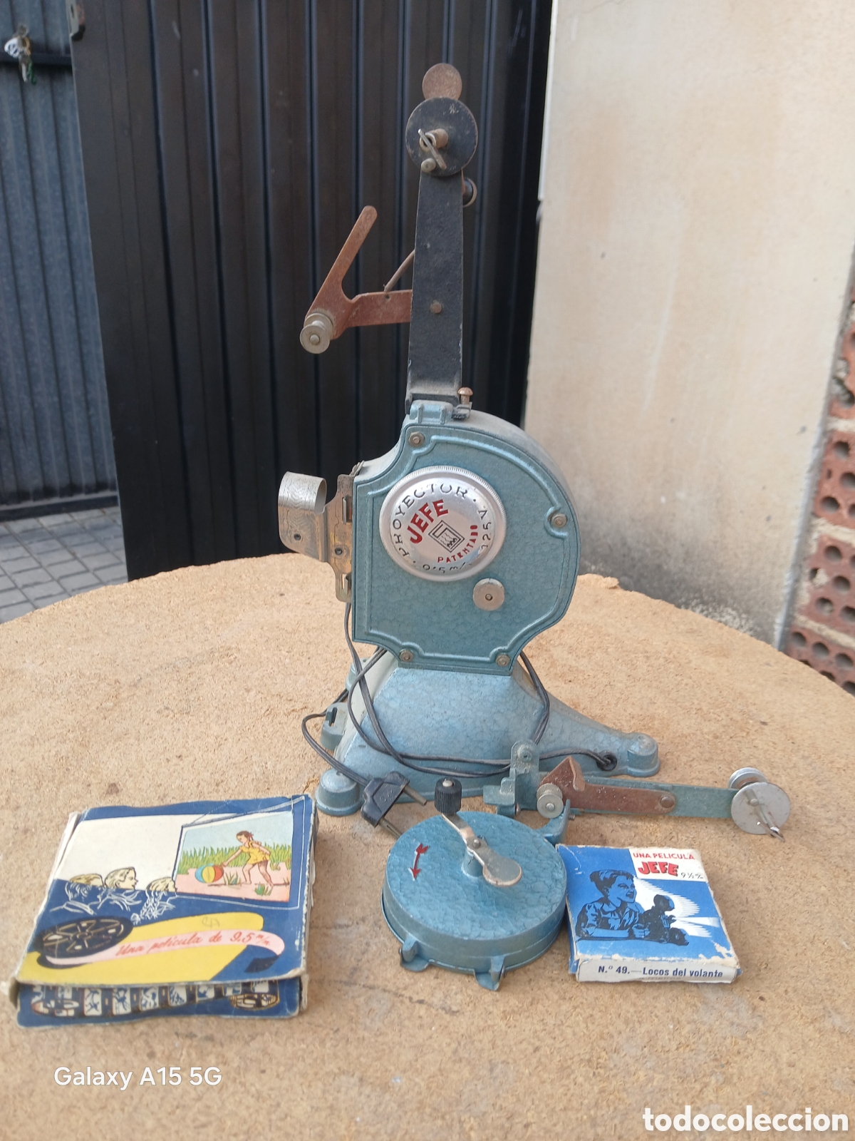 Antiquit&auml;ten: PROYECTOR JEFE CON PEL&Iacute;CULAS