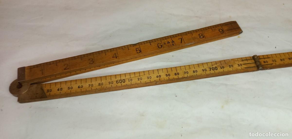 Antig&uuml;edades: ANTIGUA REGLA PLEGABLE DE MADERA Y LATON DE 100 Cm.