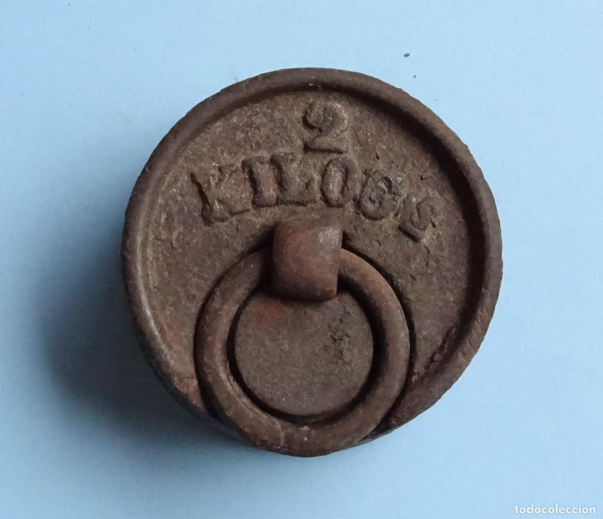 Antig&uuml;edades: Pesa de 2 kilogs kg kilogramos