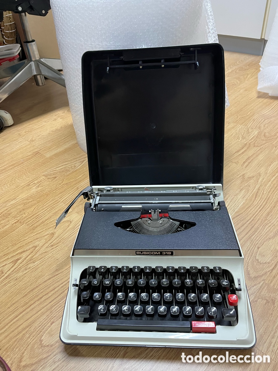 Antig&uuml;edades: M&aacute;quina de escribir port&aacute;til BUSICOM 319