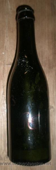 Antig&uuml;edades: Botella de cristal de 22 cms aprox.