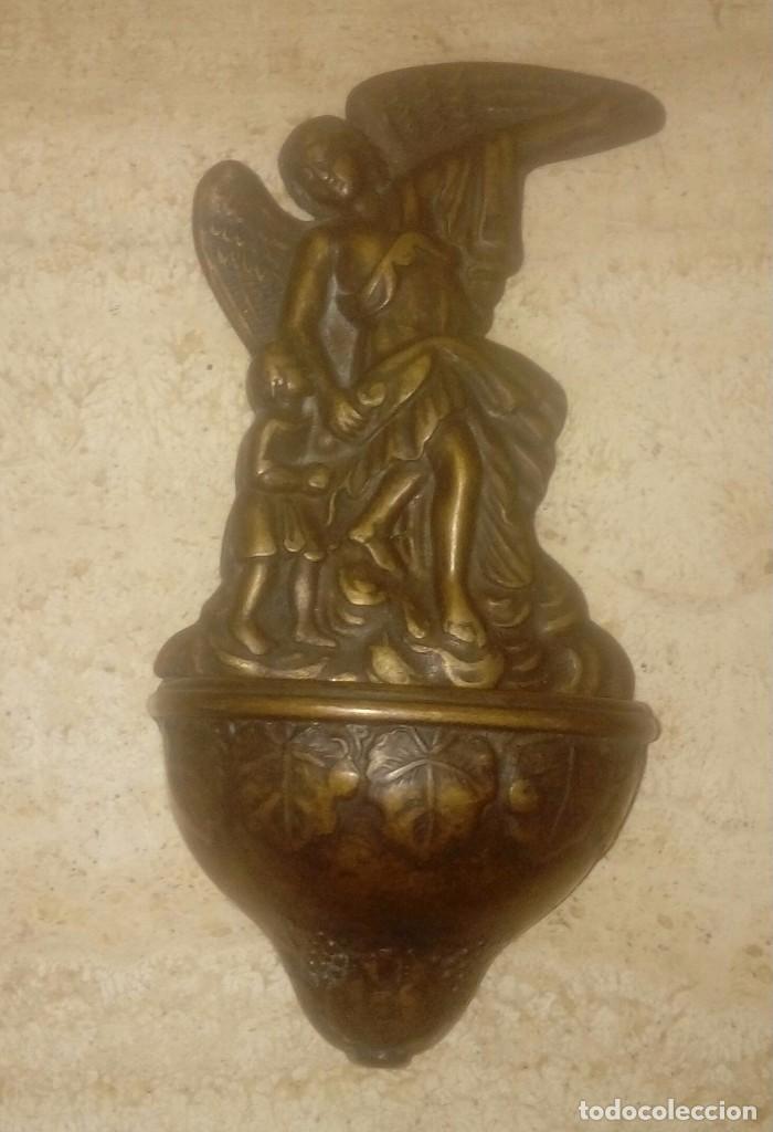 Antig&uuml;edades: Antigua benditera de bronce. - Foto 1