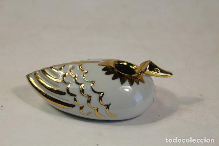 Antig&uuml;edades: pato de porcelana capodimonte y oro de ley