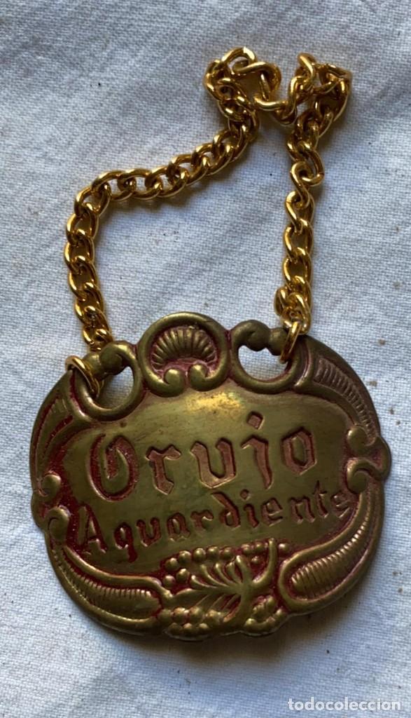 Antiquit&auml;ten: COLGANTE O COLLARIN ANTIGUO ORUJO AGUARDIENTE DE LATON DE 6 X 4