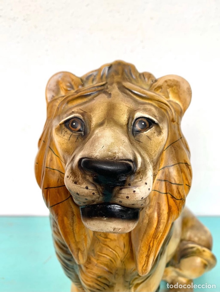 Antiguidades: ANTIGUA FIGURA DE LE&Oacute;N SENTADO