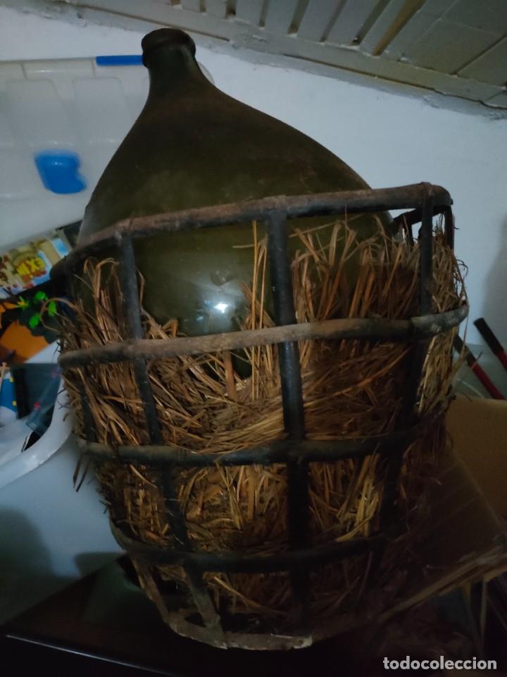 Antig&uuml;edades: DAMAJUANA CON SOPORTE HIERRO - Foto 1