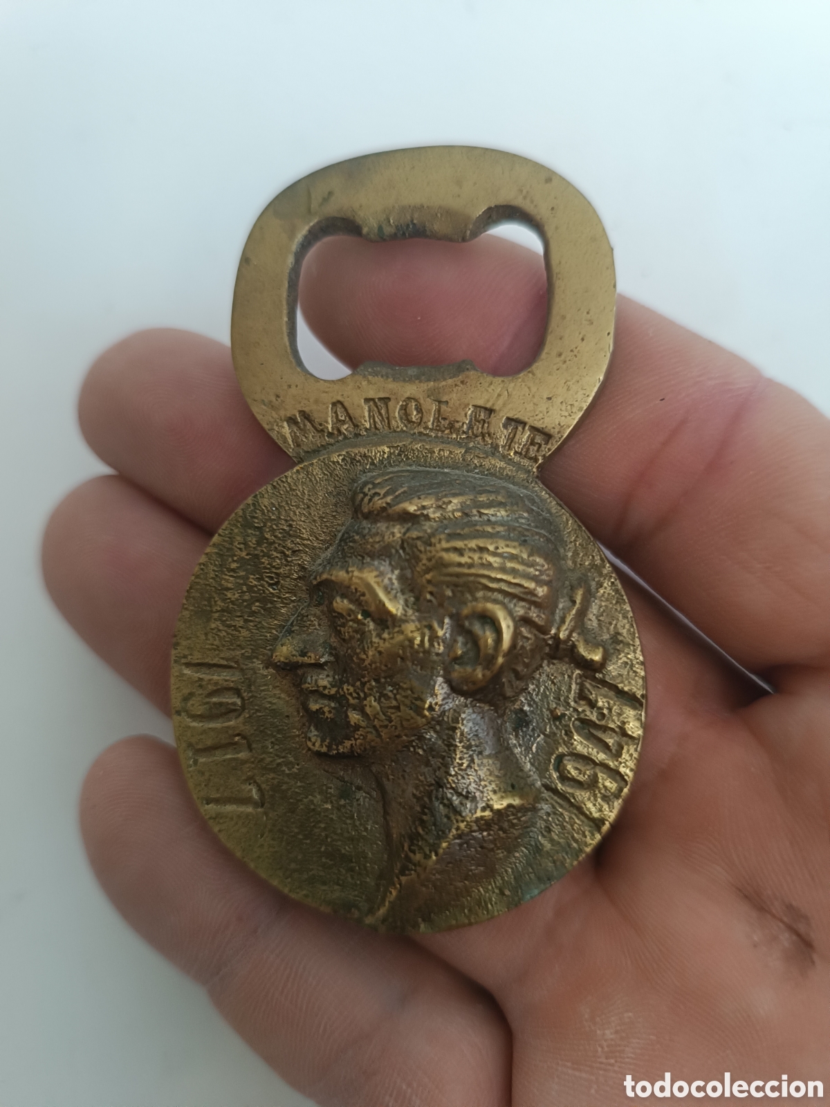 Antiguidades: Abridor de bronce macizo Manolete 1917 - 1947