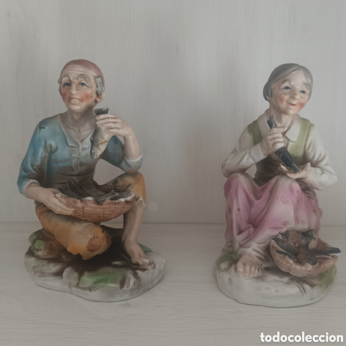 Antig&uuml;edades: Pareja de Ancianos con Peces.