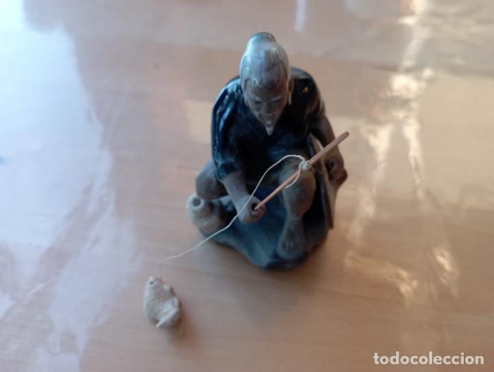 Antiquit&auml;ten: FIGURA ANCIANO PESCADOR.