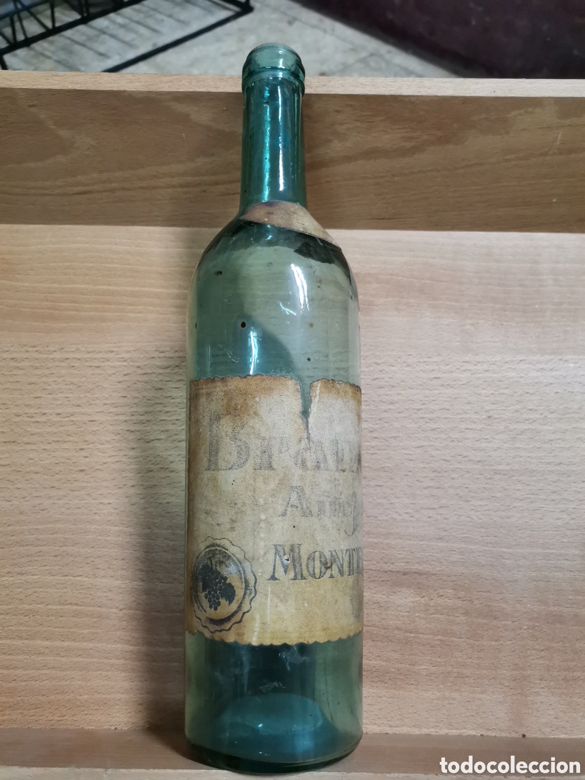 Antig&uuml;edades: Botella Vacia brandy a&ntilde;ojo montfort