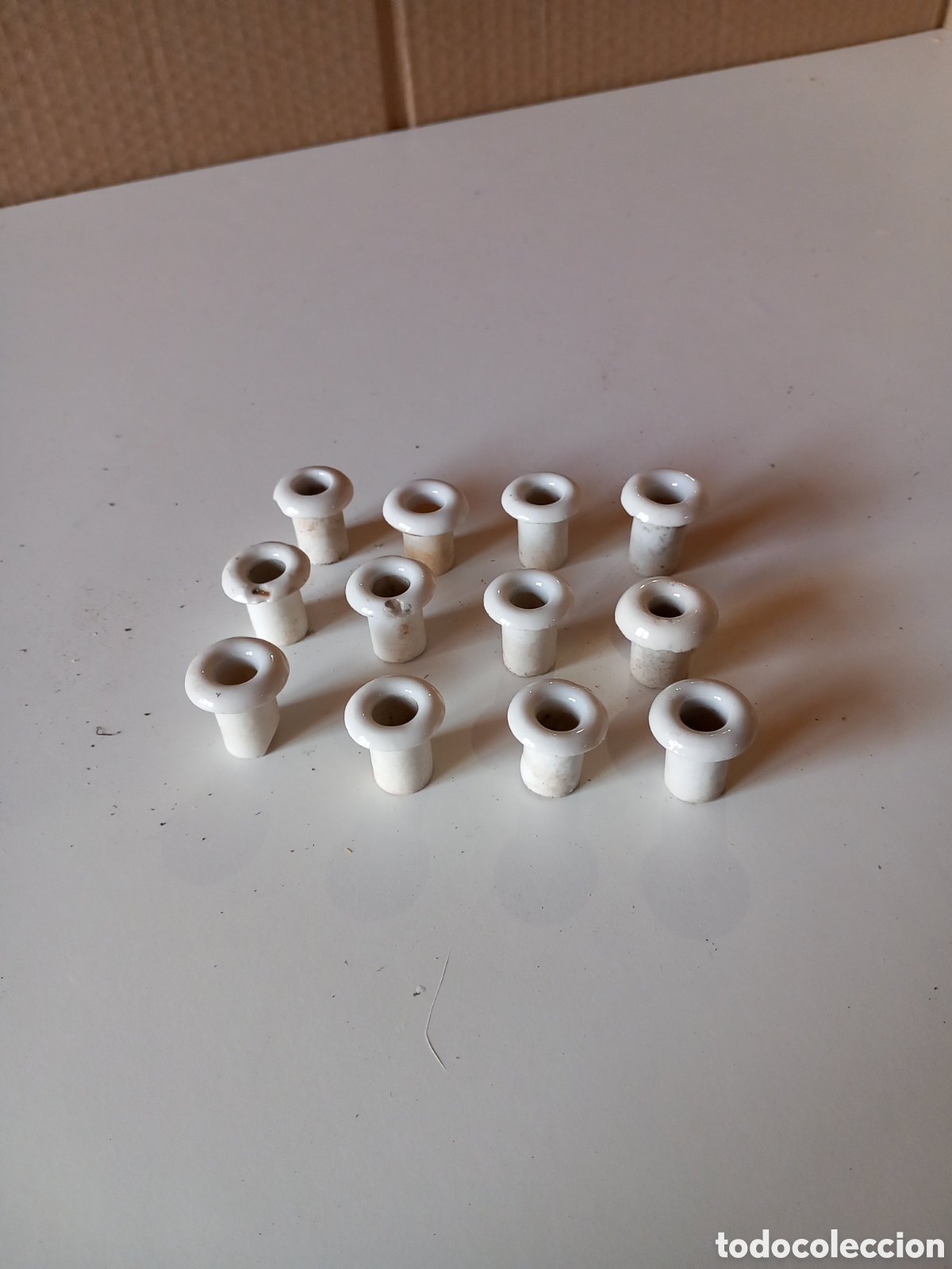 Antig&uuml;edades: Doce pasamuros de porcelana - Foto 1