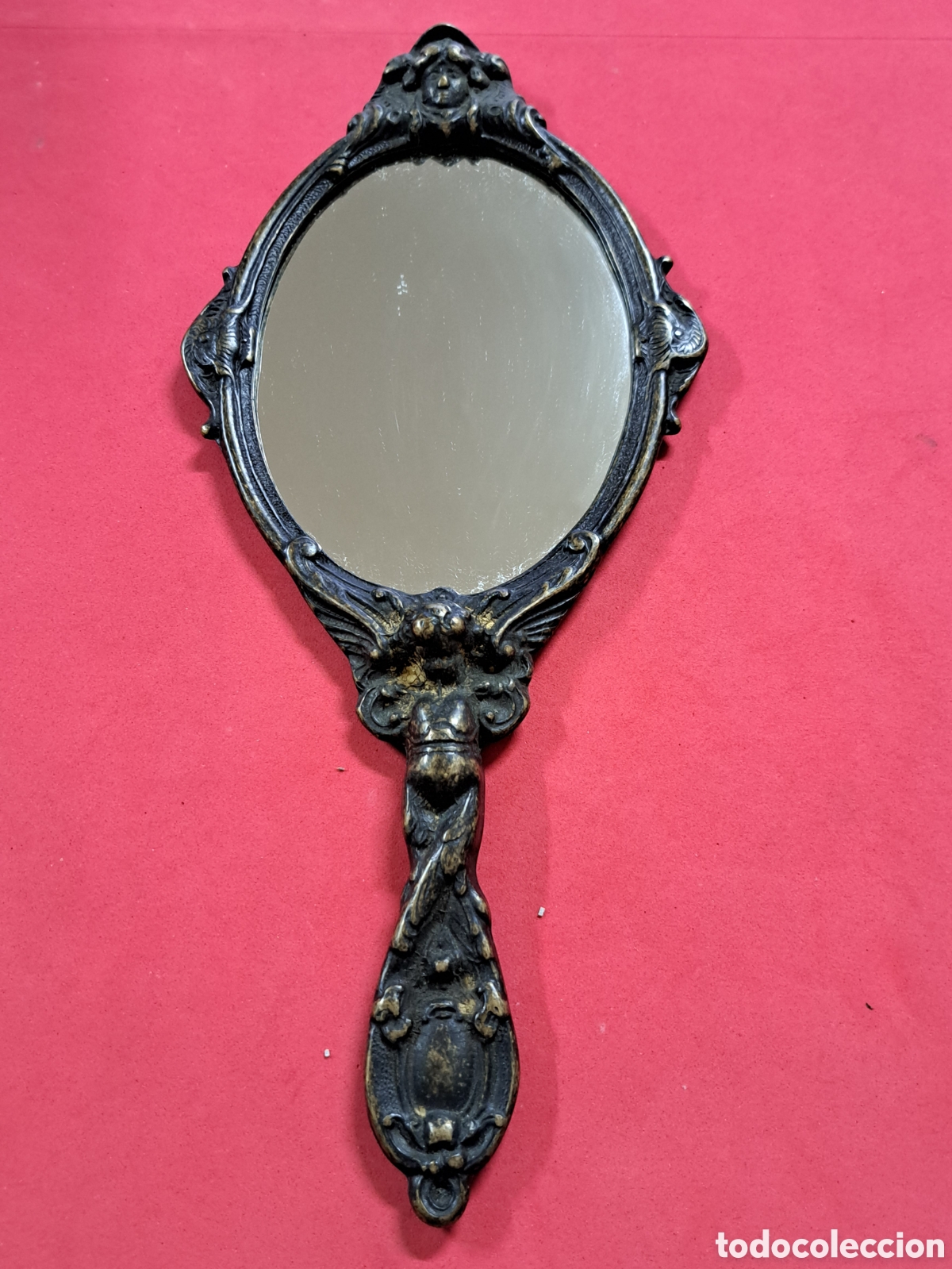 Antig&uuml;edades: Espejo de mano en bronce con angelotes mide 30,5 cms - Foto 1