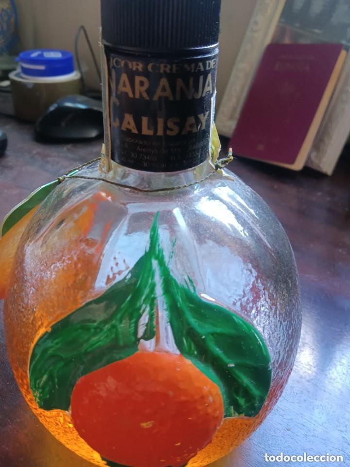 Antig&uuml;edades: Botella calisay naranja - Foto 1