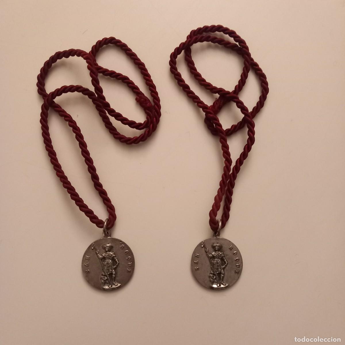 Antig&uuml;edades: DOS ANTIGUAS MEDALLAS. COFRAD&Iacute;A DE SAN ROQUE. AJO. 1956