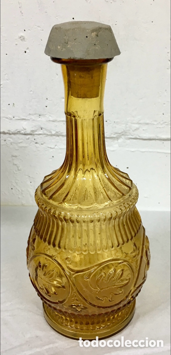 Antig&uuml;edades: Botella de cristal antigua. Color &aacute;mbar. Mid-Century.