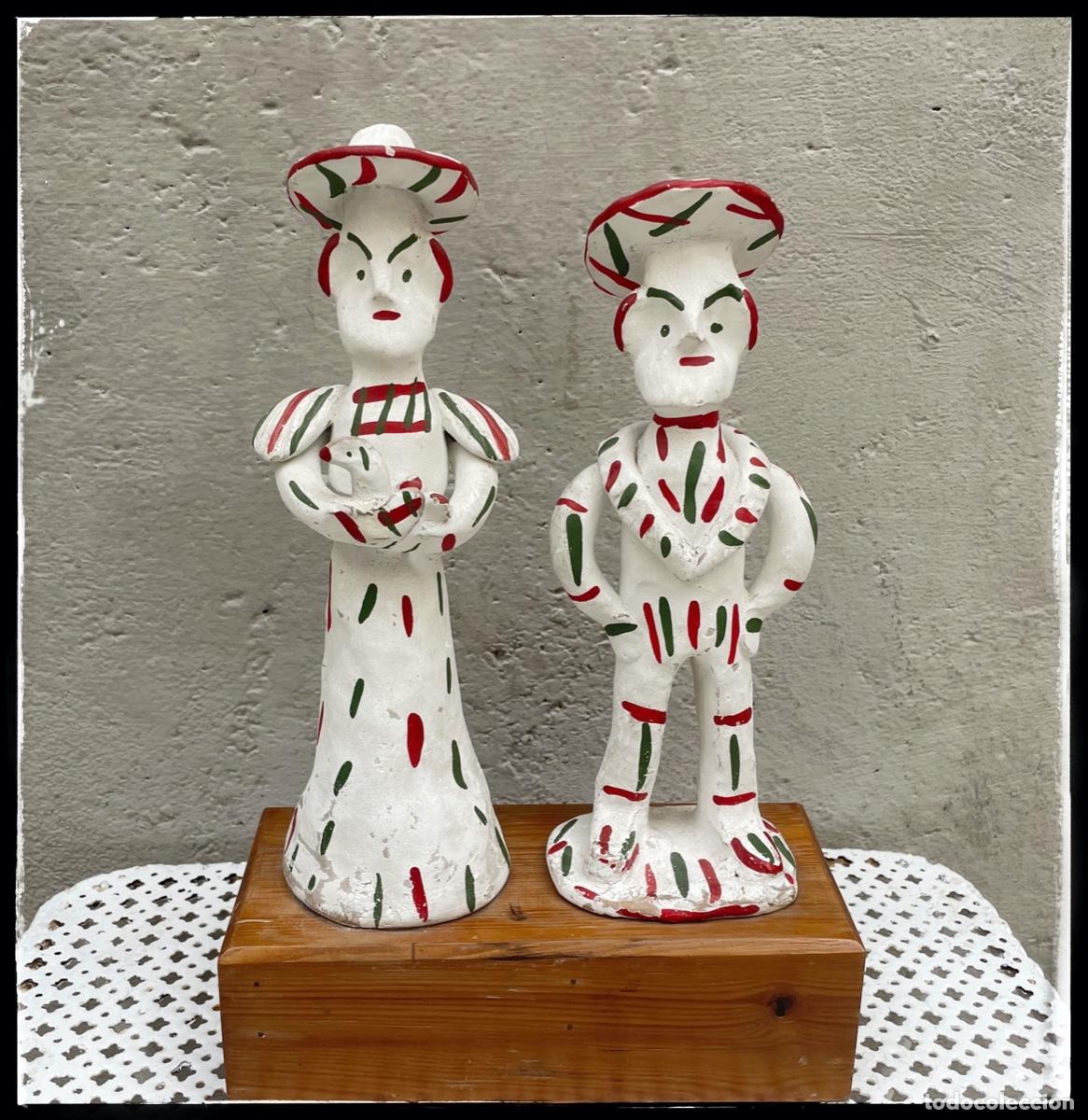 Antiguidades: Pareja de siurells sobre base de madera