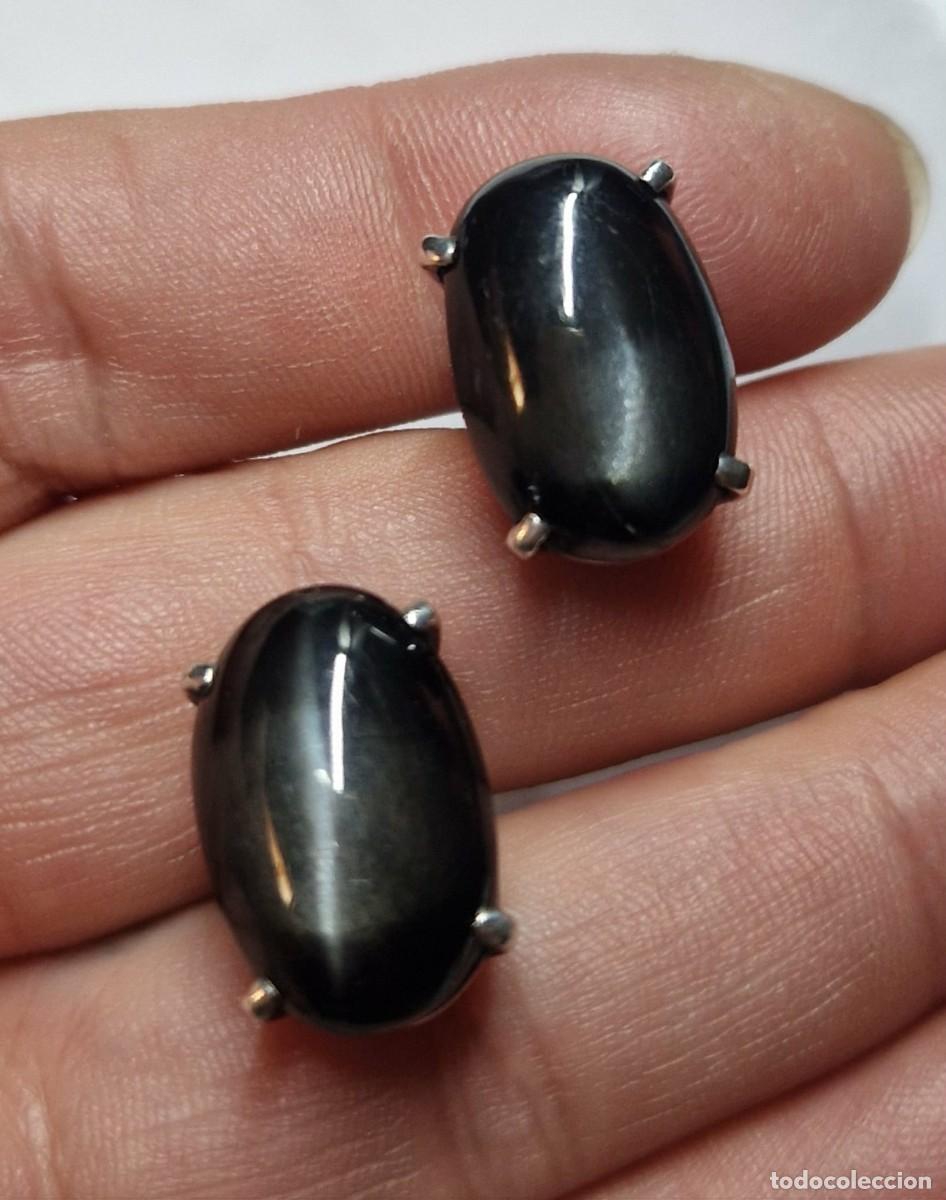 Antig&uuml;edades: Gemelos de plata con cabuj&oacute;n de ojo de gato negro