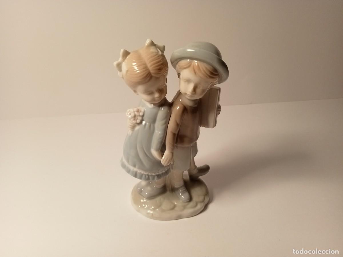 Antig&uuml;edades: FIGURA NI&Ntilde;O Y NI&Ntilde;A DE LA MANO