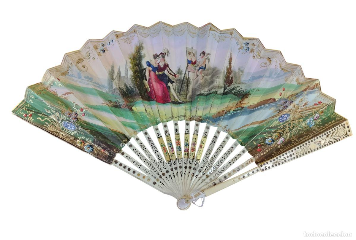 Antig&uuml;edades: PEQUE&Ntilde;O ABANICO ISABELINO CON ESCENAS BUC&Oacute;LICAS. HUESO Y PAPEL PINTADO A MANO. ESPA&Ntilde;A. XIX.