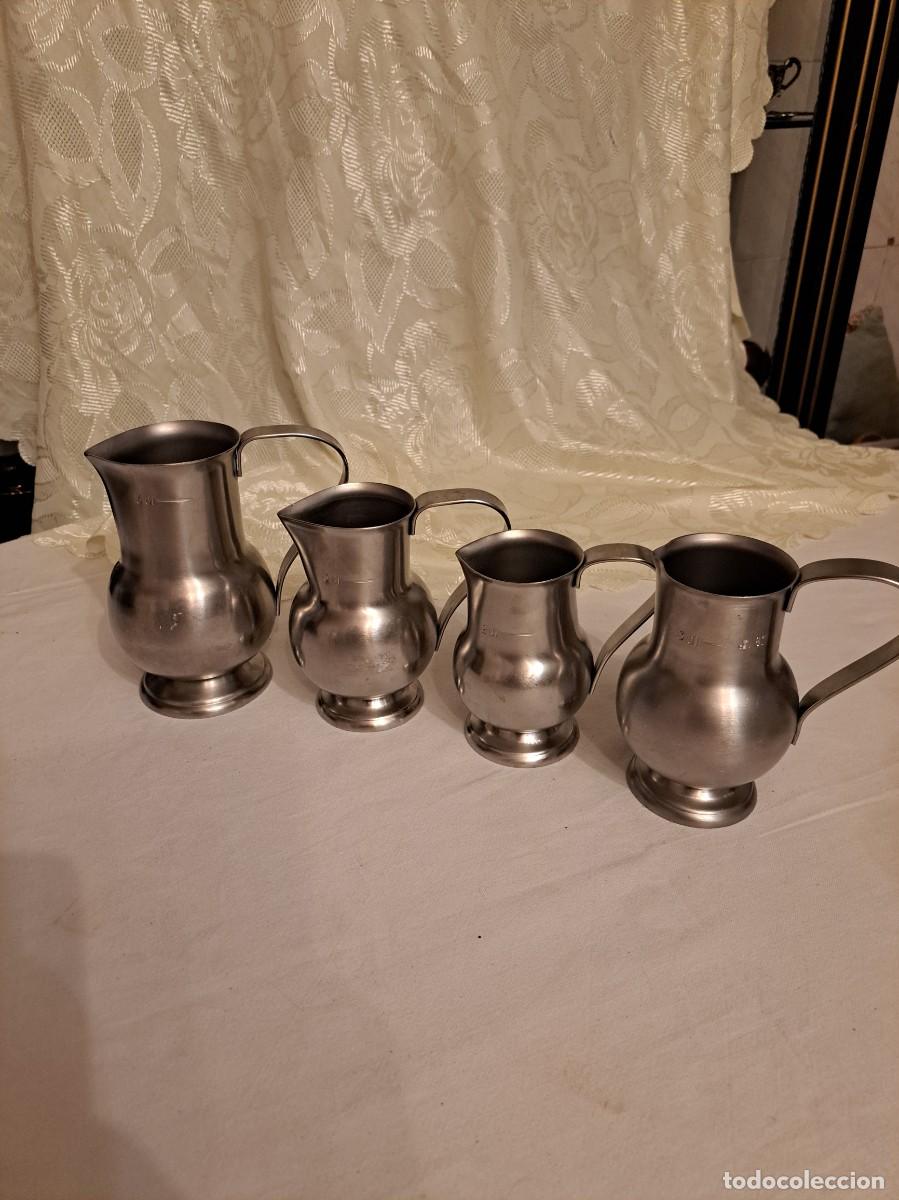 Antig&uuml;edades: Lote de 4 jarras medidoras de metal , made in france