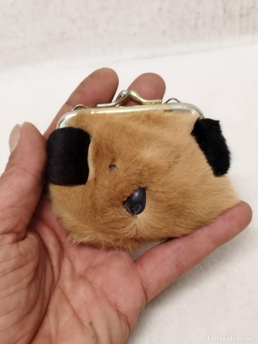 Antig&uuml;edades: Antiguo peque&ntilde;o monedero en forma de cara de animal a identificar.