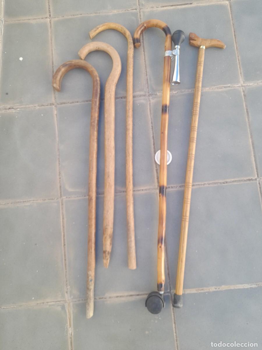 Antig&uuml;edades: Lote 5 bastones de madera, entre 75 y 95cm aprox