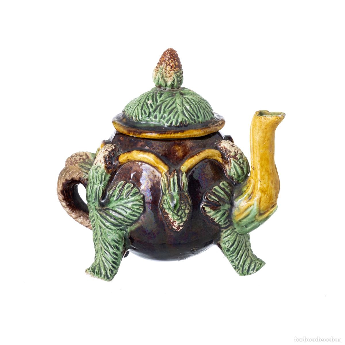 Antiques: tetera de barro