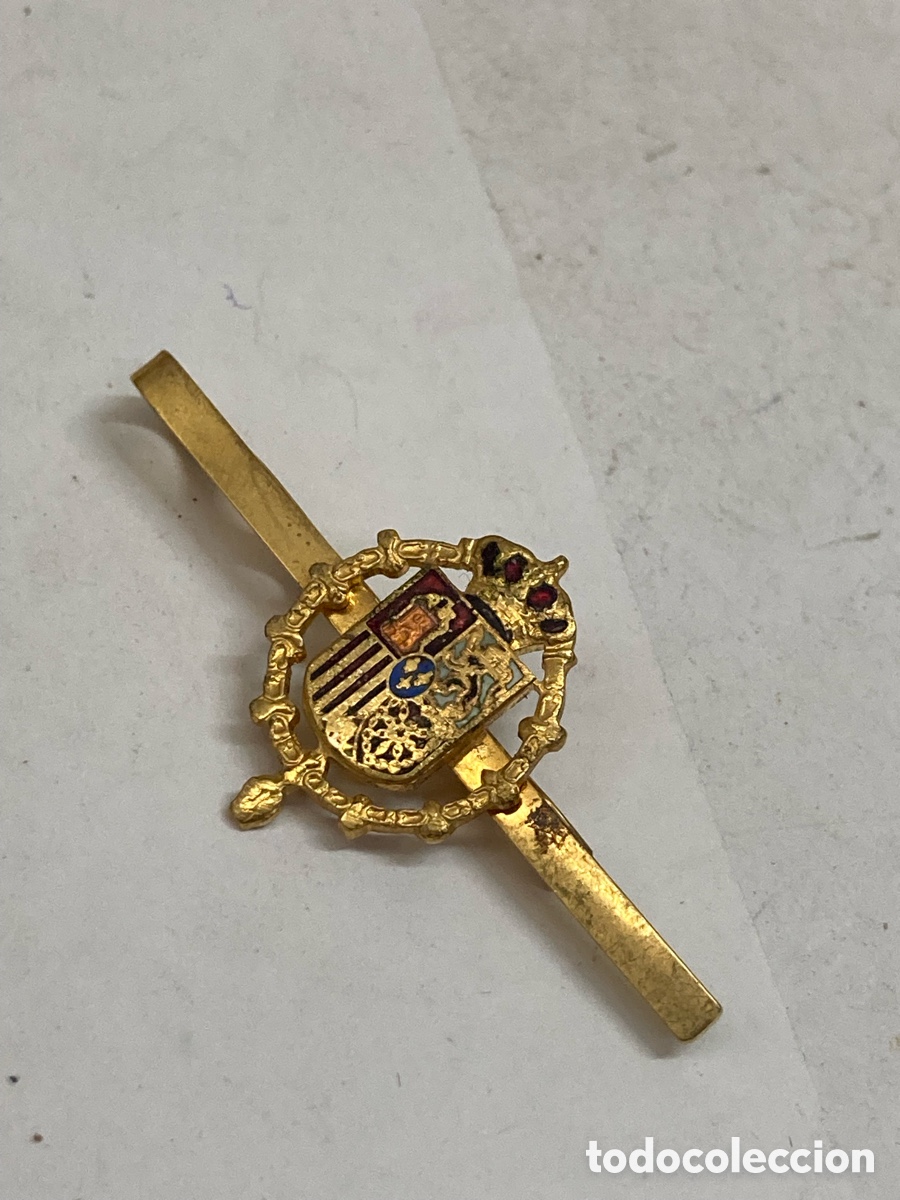 Antig&uuml;edades: pisacorbatas dorado con el Escudo de Armas de la Casa Real Espa&ntilde;ola