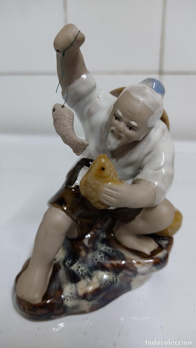 Antig&uuml;edades: Figura de porcelana pescador chino