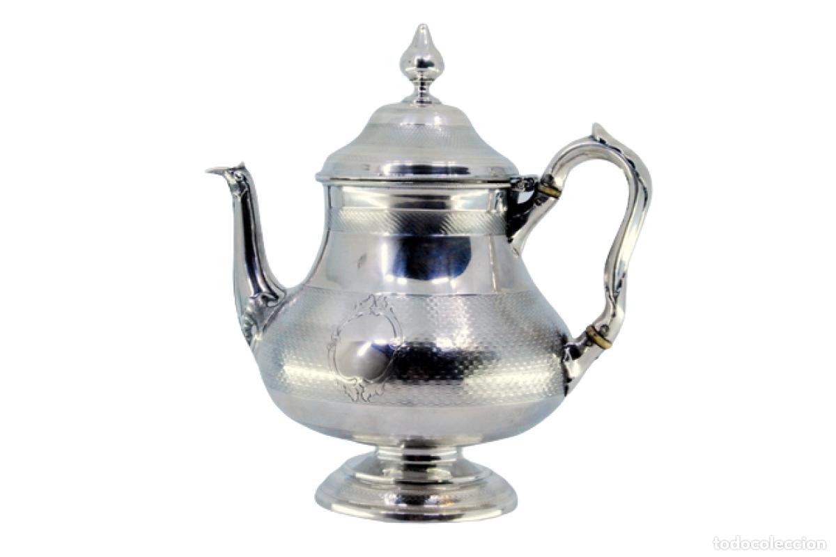 Antiquit&eacute;s: tetera de plata