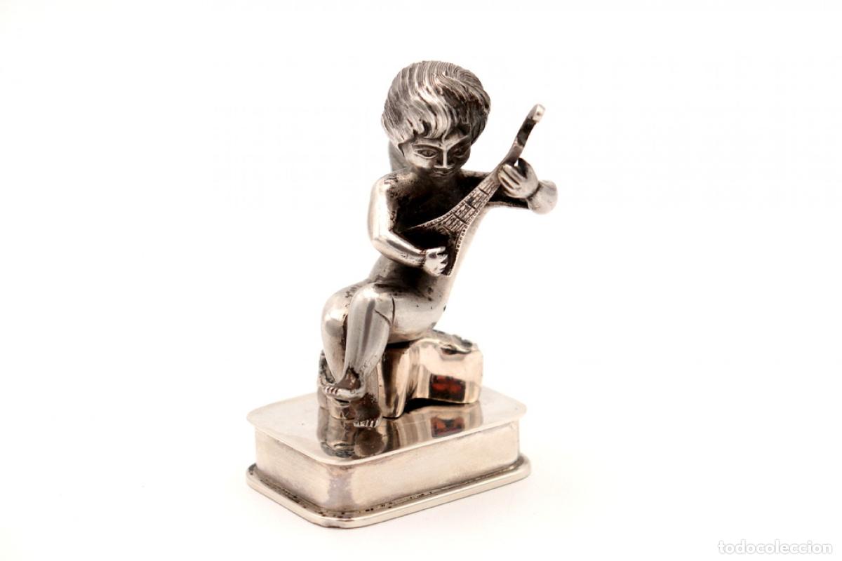 Antiques: Pisapapeles de plata