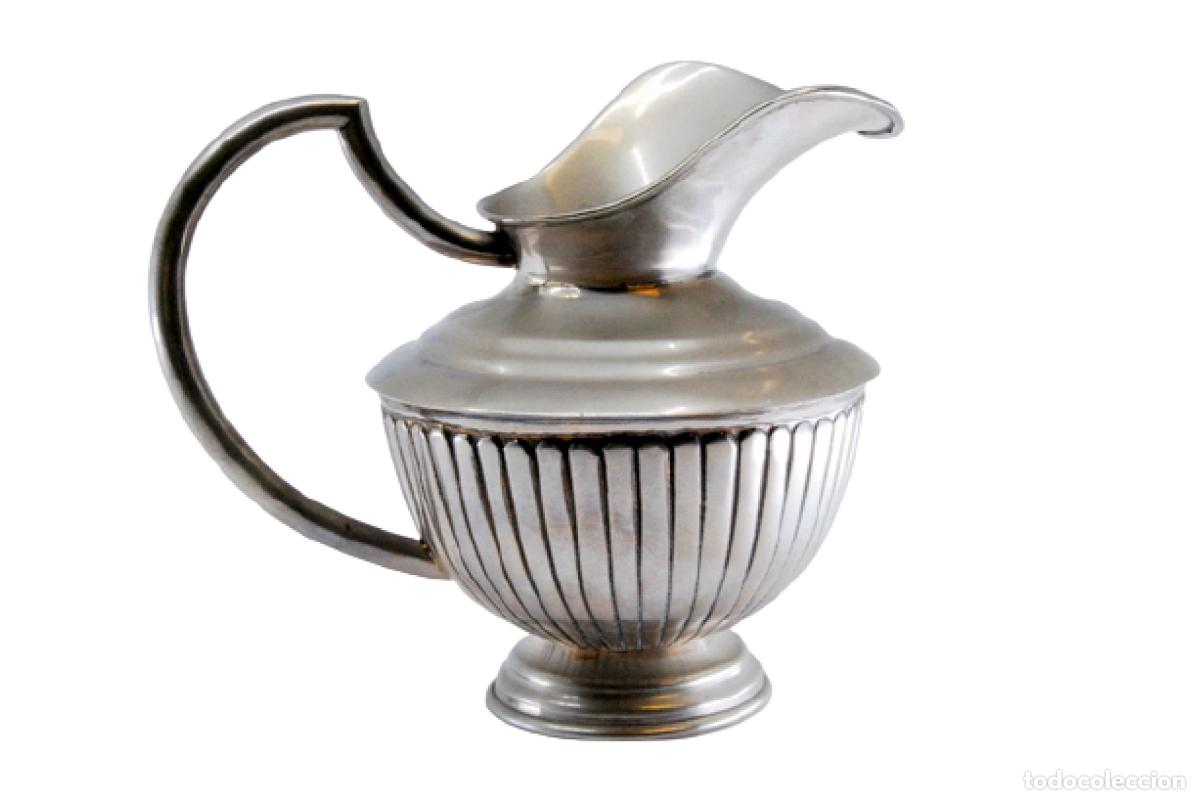 Antiques: tetera de plata