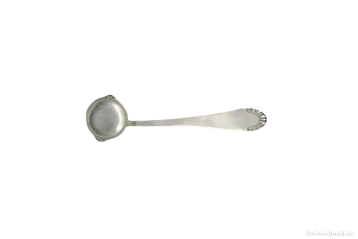 Antiques: cuchara de salsa de plata