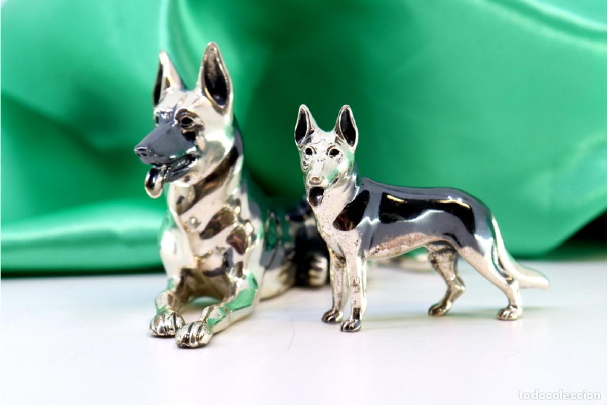 Antiques: Pareja de perros en plata