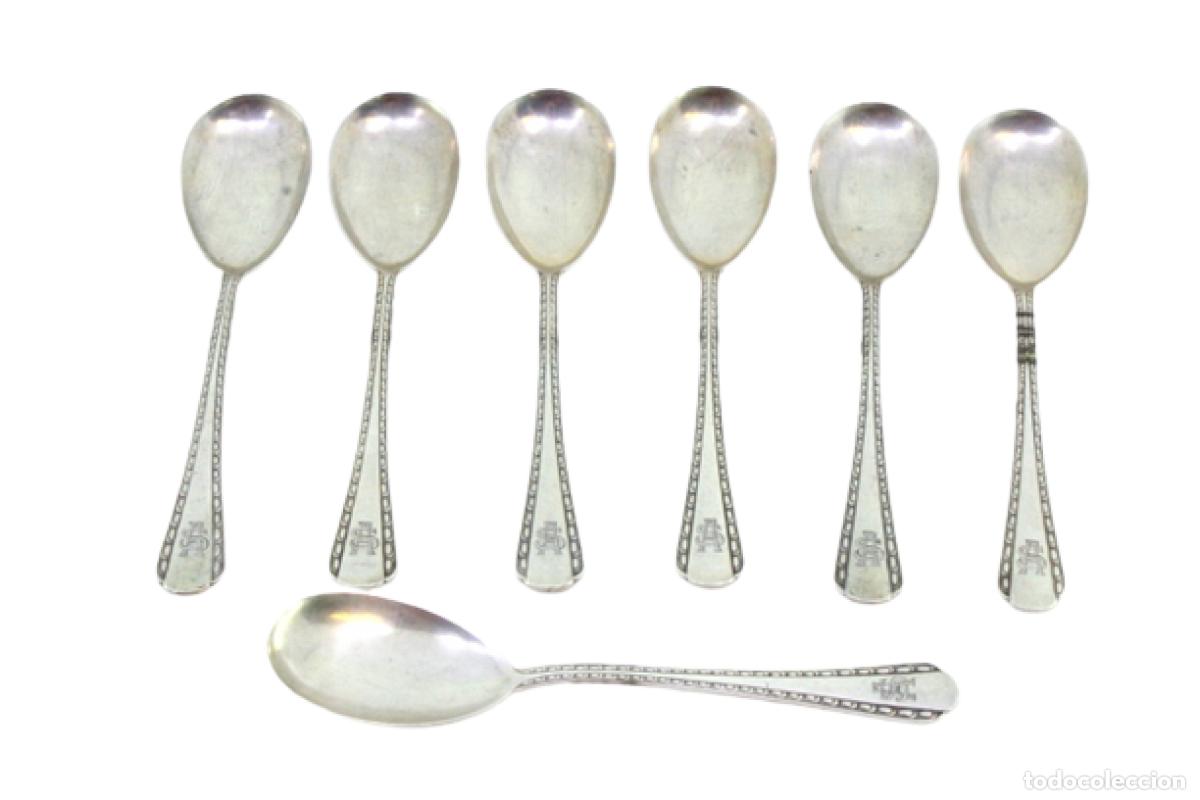 Antiques: Juego de 7 cucharas de plata para helado.