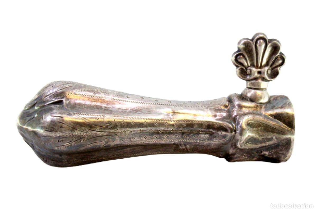 Antiques: Soporte para patas de pavo, en color plata.