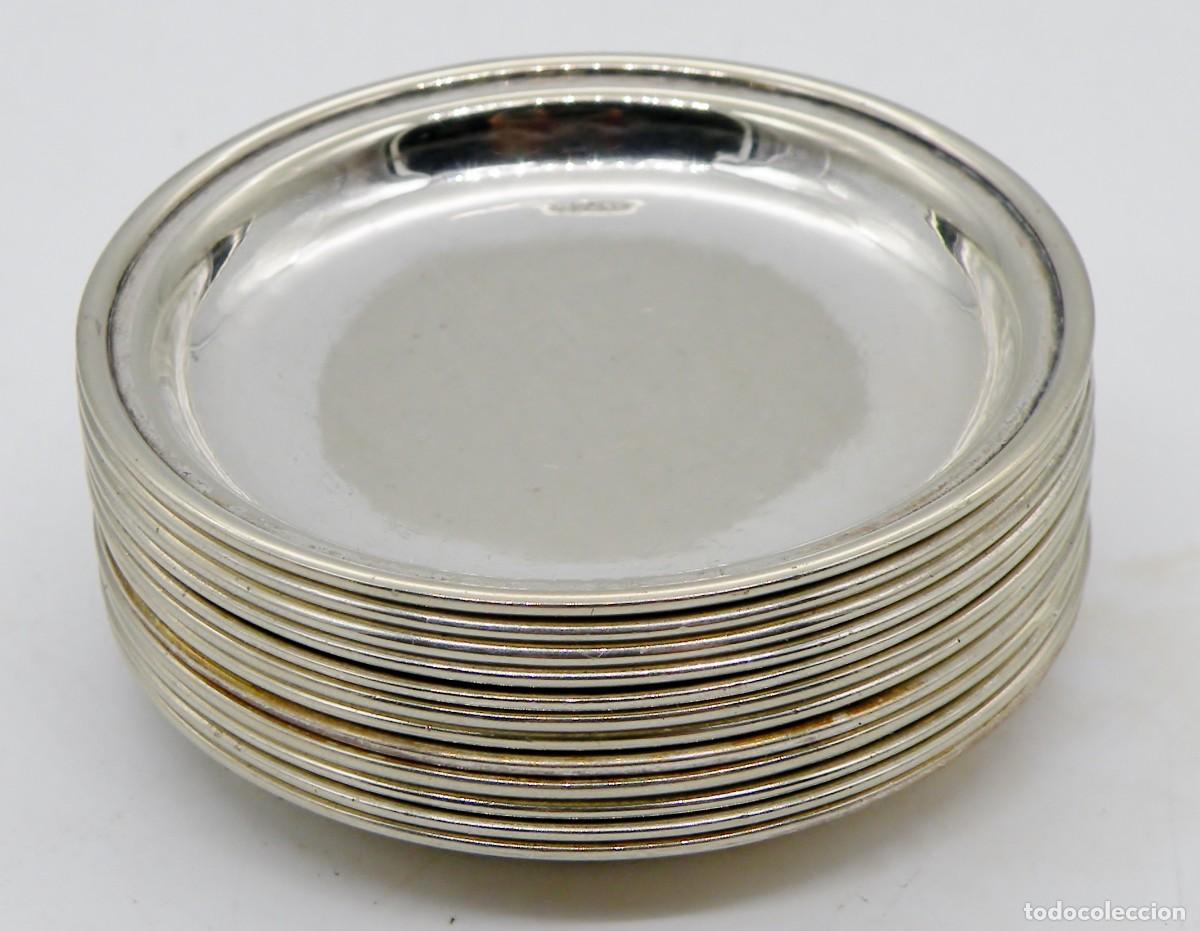 Antig&uuml;edades: 12 PLATOS DE ALPACA CONTRASTADA