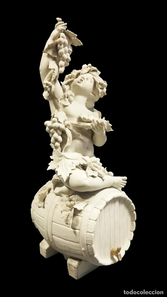 Antig&uuml;edades: FIGURA NI&Ntilde;O BACO ALEGORIA AL VINO DE BISCUIT